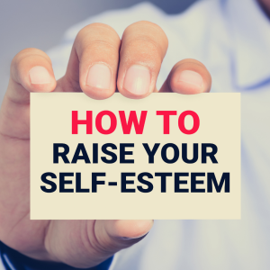 A hand holding a card that reads 'How to Raise Self-Esteem,' with a softly blurred background, focusing on the positive and motivational message.