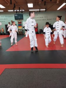 a group of new students on the mat at our kung fu school in bellevue