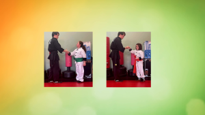 Coda and Henna receive new green and orange sashes from Mr. Robertson at American Academies of Martial Arts—kids martial arts in Bellevue.
