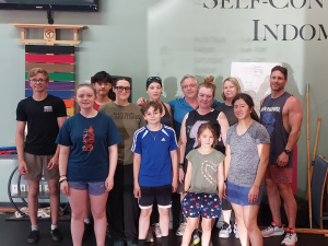 Families and participants gather after completing the Memorial Day Murph Workout at American Academies of Martial Arts in Bellevue, Nebraska