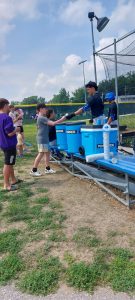 College baseball player signs autographs at Roddy Field in Bellevue NE