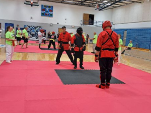 Adult martial arts students competing during a kung fu tournament at American Academies of Martial Arts in Bellevue, Nebraska