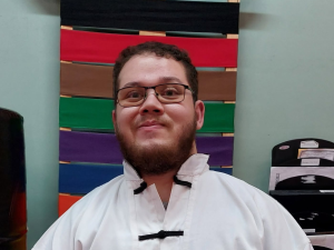 Josh at American Academies of Martial Arts, where father figures for children and their families have shaped lives through kung fu for years